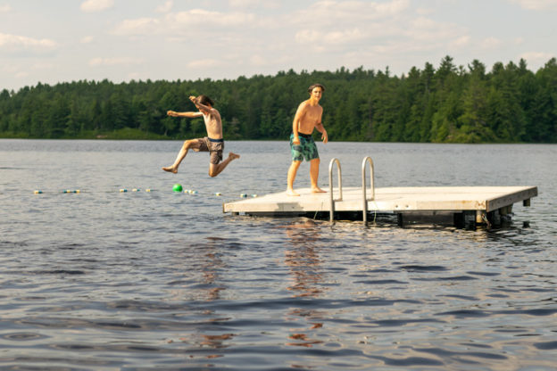 These campers played Rock, Paper, Scissors on the dock—loser jumps in the lake!