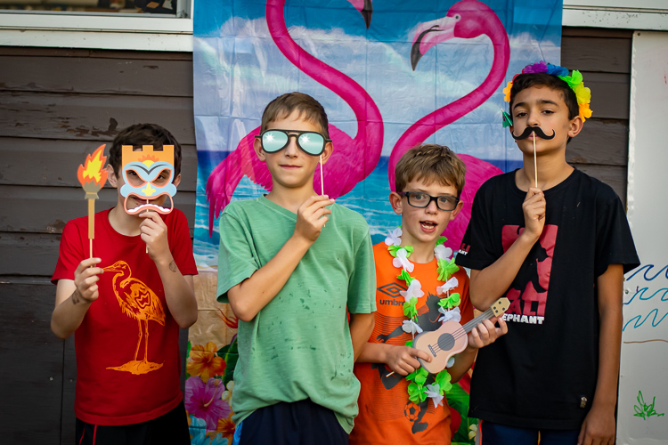 Campers try out some of the props in the photo booth