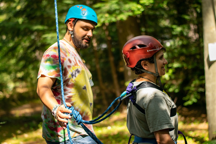 Checking knots and harness attachments at the ropes course