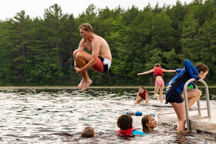 Wildwood 2021 Session 2 Camper does a cannonball off the dock