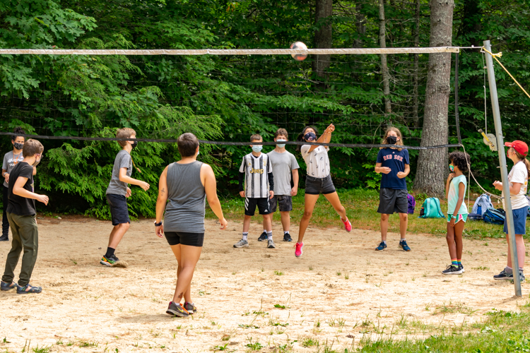 Campers playing volleyball during DGs