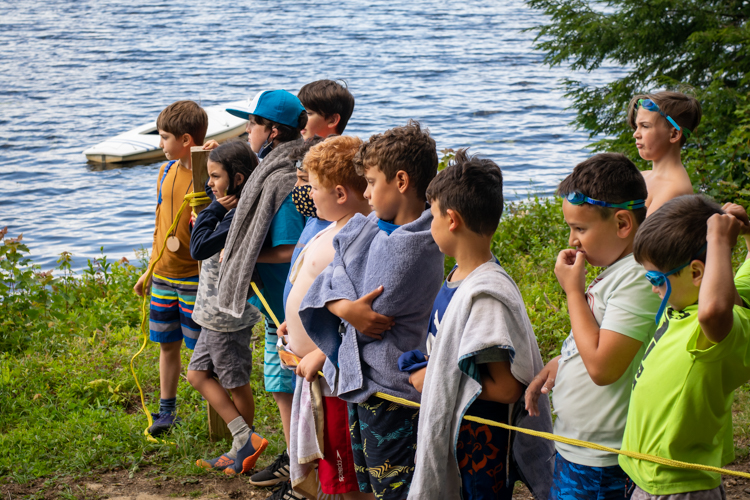 Leopold campers waiting (mostly) patiently for their swim check