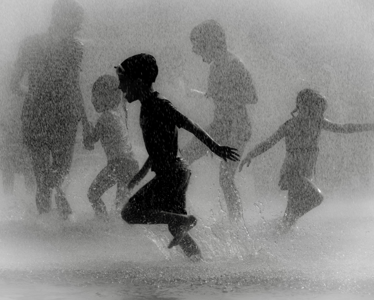 Children playing in a splash park © John Ames