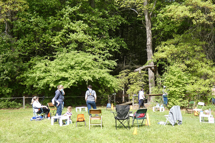 Group of people and chairs in a circle at Arcadia.