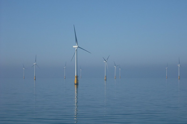 Large wind turbines in the ocean.